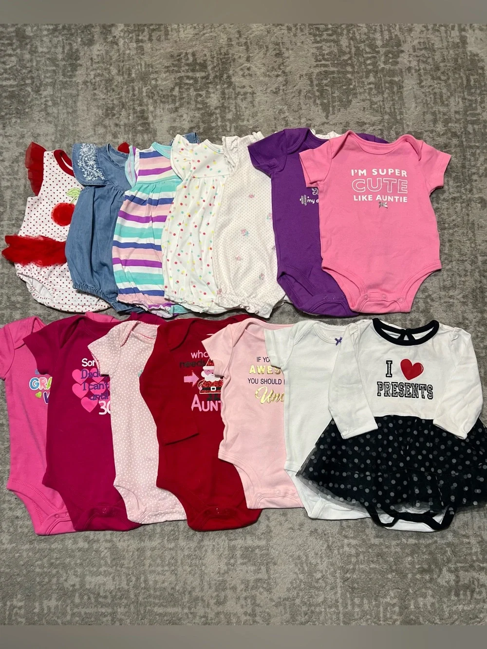Bundle of 14 baby girl onesies. Sizes 3M